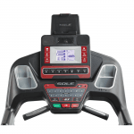 Console screen of the Sole F63 treadmill. The features includes 2 cup holders, multiple button functions, speakers, a mini fan and a tablet holder