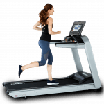 A fit woman in athletic attire running on the Landice L7 LTD Treadmill