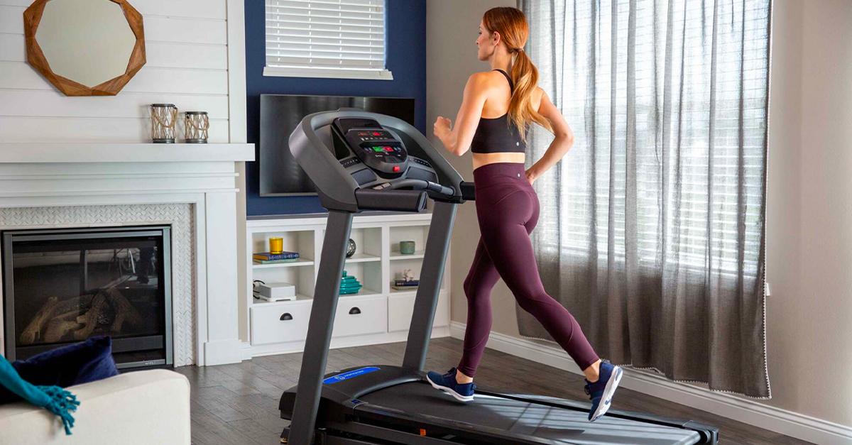 Woman running on Horizon Treadmill